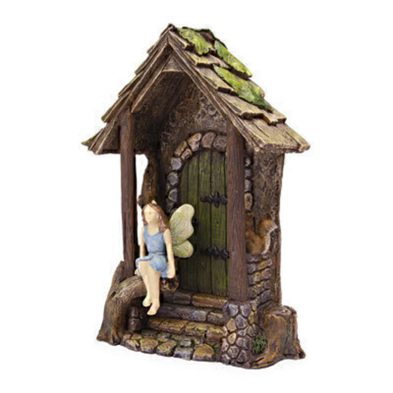 A cute Woodland Knoll miniature fairy with pale blue dress and wings that are brushed with pale green. This sweet fairy is sitting down on the steps to a hidden entrance and is joined by a small squirrel. The wooden hidden entrance doorway would be right at home in your miniature fairy garden either indoors our outdoors.